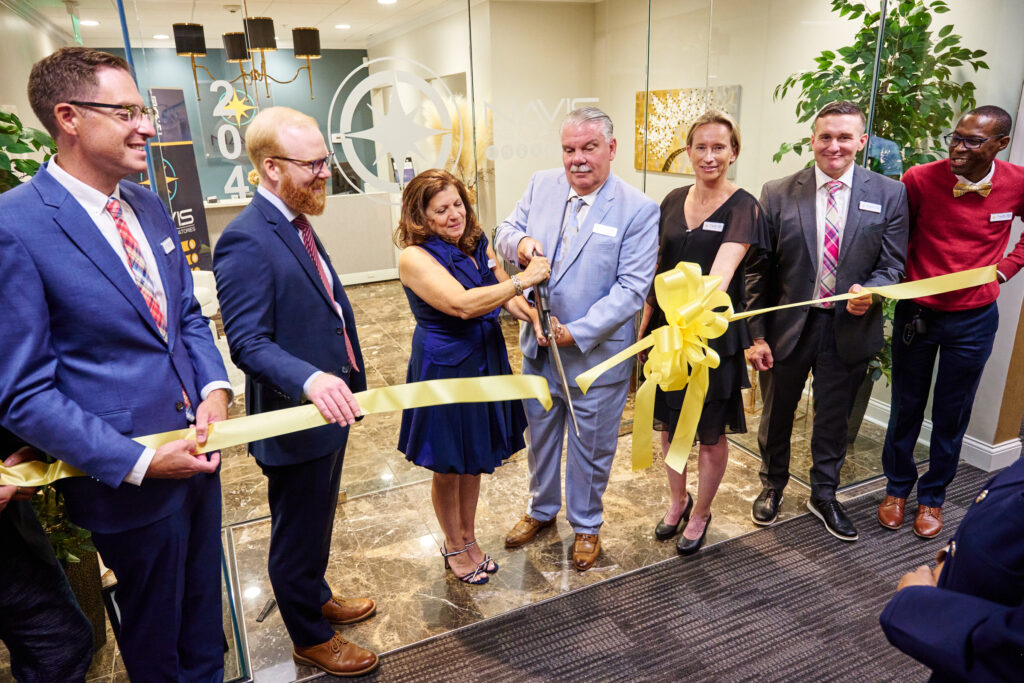 Dr. Richard Stripp and his wife, Maureen, cut the ribbon celebrating the grand opening of Navis Clinical Laboratories’ new corporate headquarters.