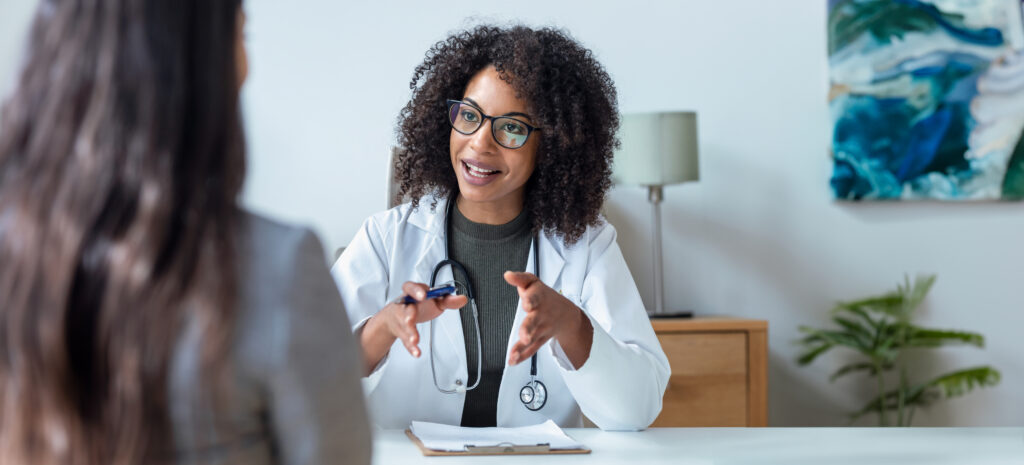 Female doctor explaining medical treatment to patient.